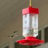 a hummingbird feeder away from windows