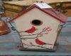 a cardinal bird house